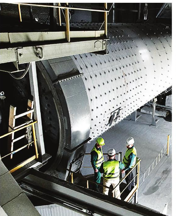 ADING engineers on a walkway beside a cement ball mill